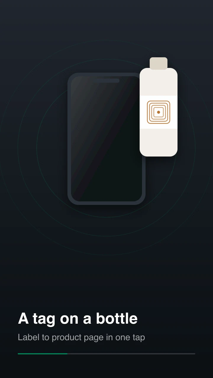 A phone tapped against an NFC sticker on a bottle label