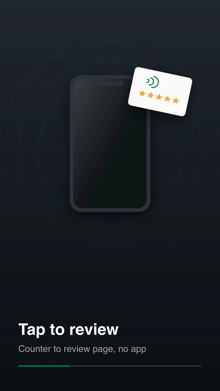A phone held against a countertop review stand as the review page opens on screen
